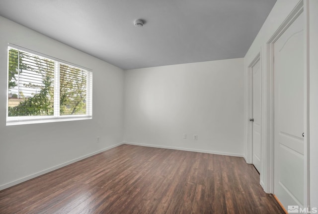 6850 Sharlands Ave Unit A2003, Reno, NV 89523 - unfurnished bedroom featuring dark wood-type flooring and baseboards