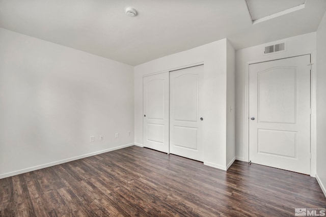6850 Sharlands Ave Unit A2003, Reno, NV 89523 - unfurnished bedroom with dark wood-style flooring, attic access, baseboards, and a closet