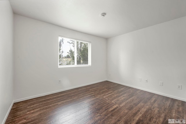 6850 Sharlands Ave Unit A2003, Reno, NV 89523 - unfurnished room featuring dark wood-type flooring and baseboards