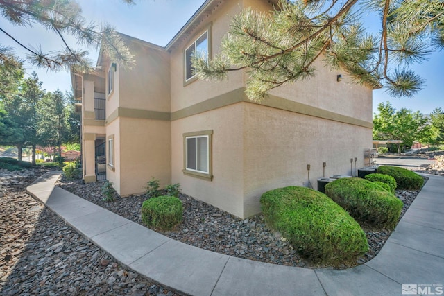 6850 Sharlands Ave Unit A2003, Reno, NV 89523 - view of property exterior with stucco siding and cooling unit