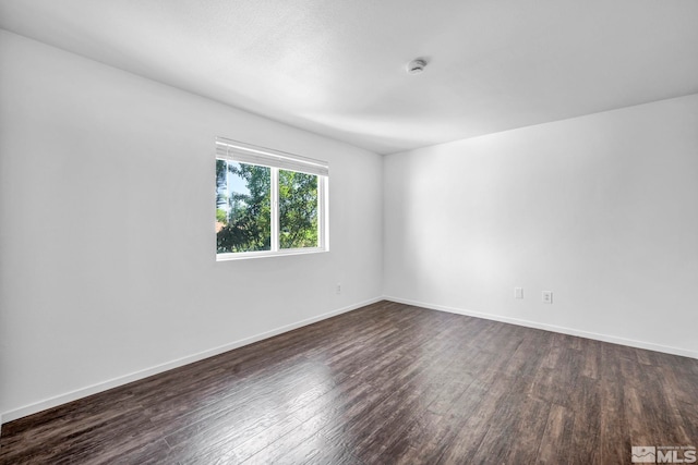 6850 Sharlands Ave Unit A2003, Reno, NV 89523 - spare room featuring dark wood finished floors, baseboards, and a smoke detector