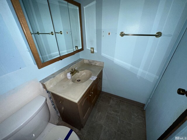 1020 Baywood Dr Unit B, Sparks, NV 89434 - bathroom featuring toilet, vanity, and baseboards