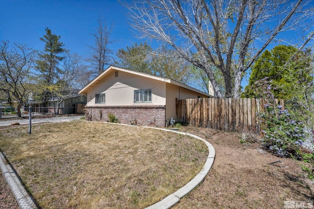 1308 Fremont, Carson City, NV 89701 - view of home's exterior featuring brick siding and fence