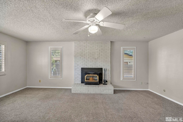 1308 Fremont, Carson City, NV 89701 - unfurnished living room featuring plenty of natural light, carpet, ceiling fan, a textured ceiling, and baseboards