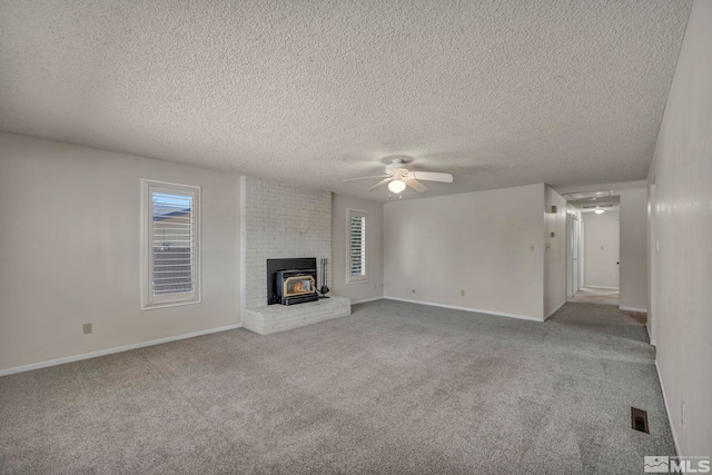 1308 Fremont, Carson City, NV 89701 - unfurnished living room featuring a ceiling fan, carpet, a textured ceiling, healthy amount of natural light, and baseboards