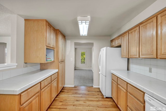 1308 Fremont, Carson City, NV 89701 - kitchen with white appliances, light wood-style floors, tasteful backsplash, and baseboards