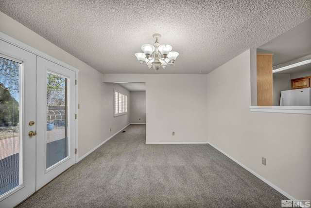 1308 Fremont, Carson City, NV 89701 - unfurnished dining area featuring a chandelier, carpet flooring, baseboards, and a textured ceiling