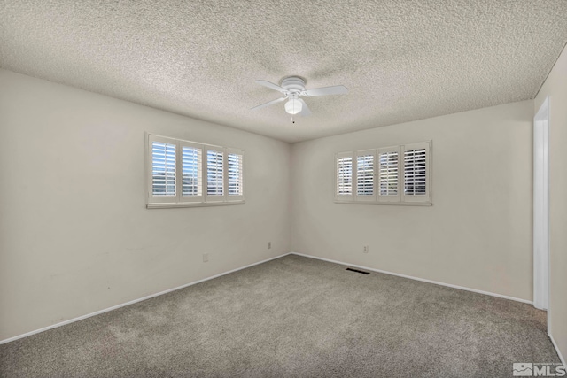 1308 Fremont, Carson City, NV 89701 - carpeted empty room with a ceiling fan, plenty of natural light, a textured ceiling, and baseboards
