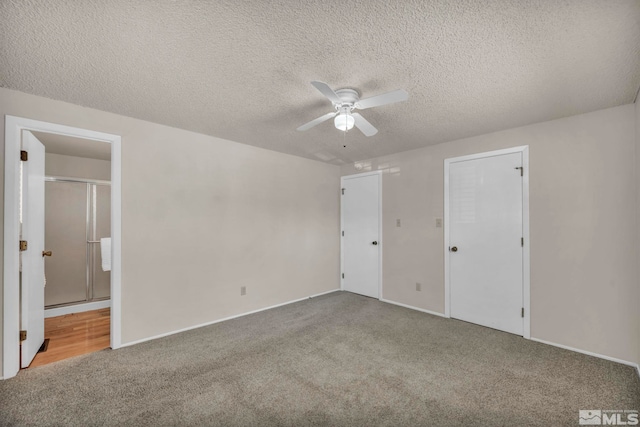 1308 Fremont, Carson City, NV 89701 - unfurnished bedroom with carpet flooring, a textured ceiling, baseboards, and connected bathroom