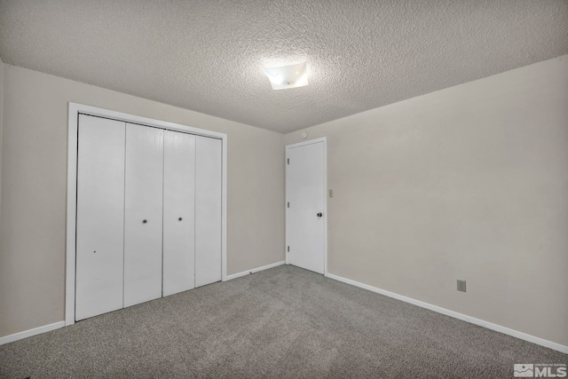 1308 Fremont, Carson City, NV 89701 - unfurnished bedroom featuring carpet, a closet, a textured ceiling, and baseboards