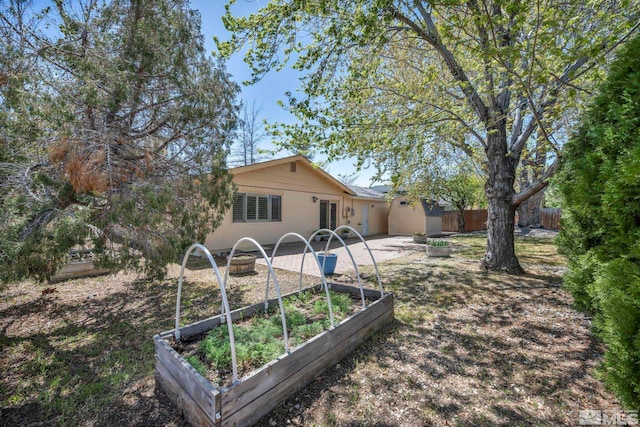 1308 Fremont, Carson City, NV 89701 - view of yard featuring fence, a garden, and french doors