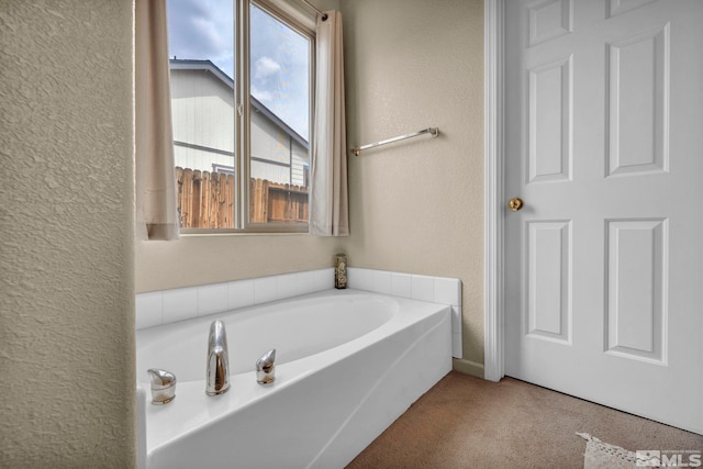 215 Red Wing Dr, Dayton, NV 89403 - bathroom featuring a textured wall and a garden tub