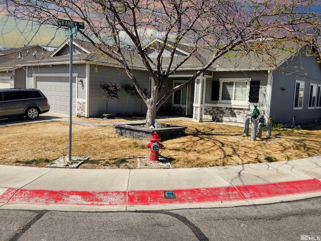 298 Fallen Leaf Ln, Fernley, NV 89408 - view of front of property with a garage and stone siding