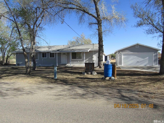 20 Cherry Ln, Yerington, NV 89447 - ranch-style home with an outdoor structure, a detached garage, and covered porch