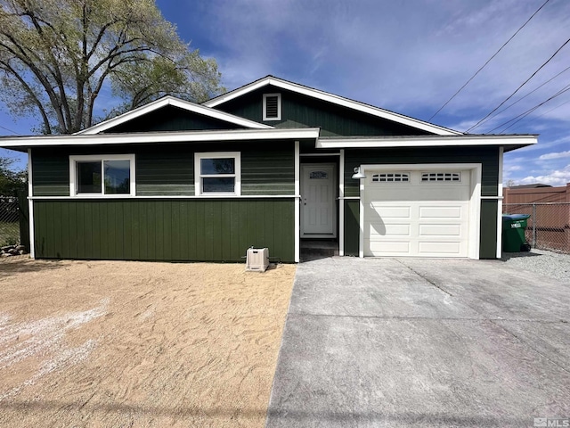 520 E Taylor St, Reno, NV 89502 - view of front of house with an attached garage, concrete driveway, and fence