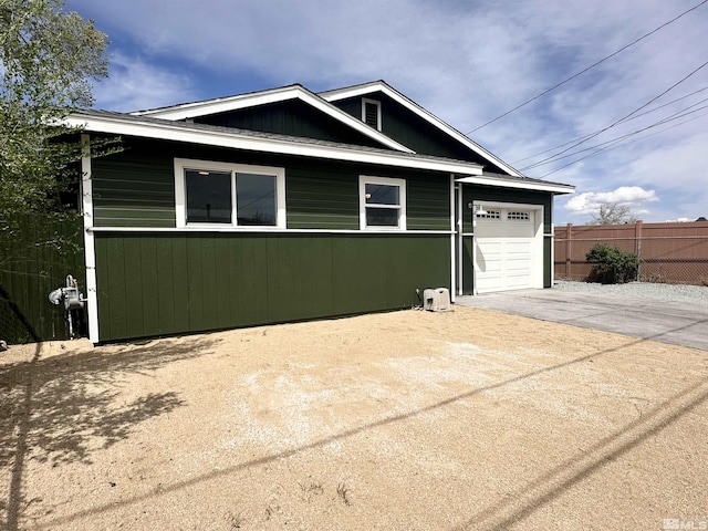 520 E Taylor St, Reno, NV 89502 - view of front of home featuring driveway, fence, and a garage