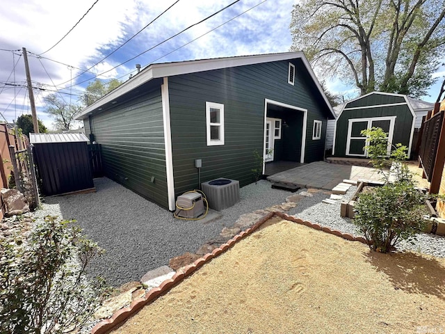 520 E Taylor St, Reno, NV 89502 - back of house with a shed, an outdoor structure, a patio area, and central AC unit