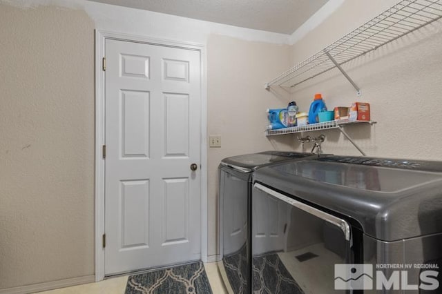 324 Occidental Dr, Dayton, NV 89403 - laundry area with washer and dryer and baseboards