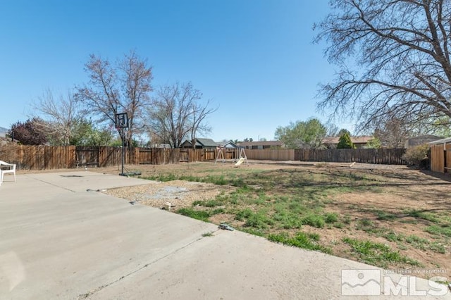324 Occidental Dr, Dayton, NV 89403 - fenced backyard with a patio area