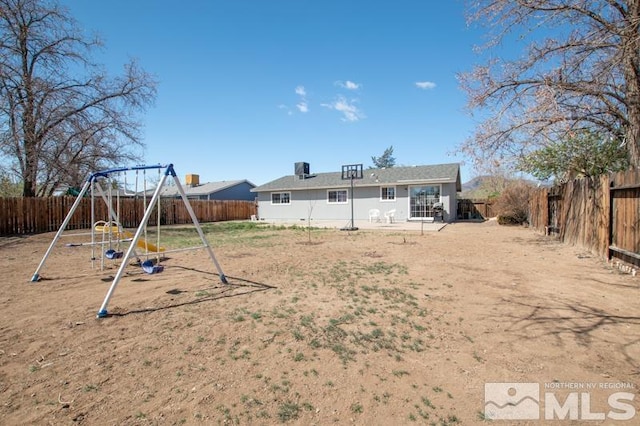 324 Occidental Dr, Dayton, NV 89403 - fenced backyard featuring a playground