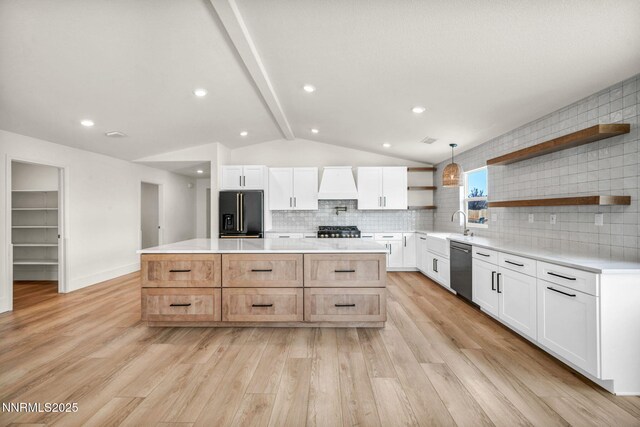 1144 Spruce Meadows Dr, Sparks, NV 89441 - kitchen featuring black fridge with ice dispenser, open shelves, dishwasher, a kitchen island, and light wood-style floors