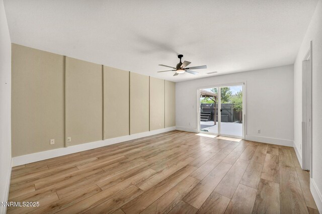 1144 Spruce Meadows Dr, Sparks, NV 89441 - unfurnished room featuring light wood-style floors and a ceiling fan