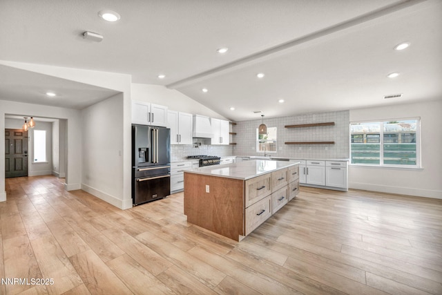 1144 Spruce Meadows Dr, Sparks, NV 89441 - kitchen featuring high quality appliances, open shelves, white cabinetry, a center island, and decorative backsplash