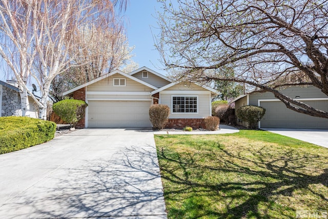 1774 Evergreen Ct, Minden, NV 89423 - view of front of property with brick siding, driveway, a front yard, and an attached garage