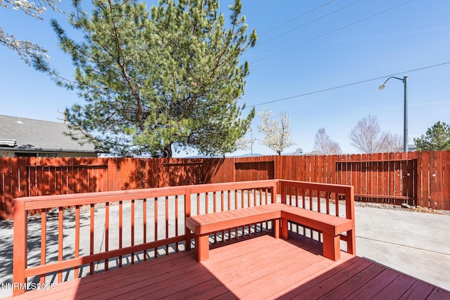 1774 Evergreen Ct, Minden, NV 89423 - wooden deck featuring a fenced backyard and a patio
