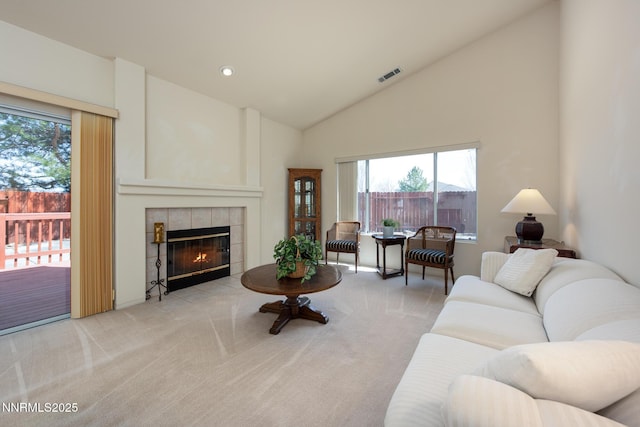 1774 Evergreen Ct, Minden, NV 89423 - living area featuring carpet floors, a tile fireplace, recessed lighting, and high vaulted ceiling
