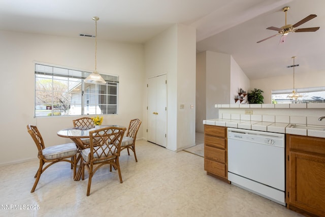 1774 Evergreen Ct, Minden, NV 89423 - dining space with a ceiling fan, light floors, and high vaulted ceiling