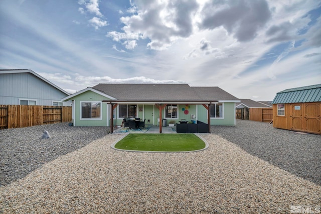 534 Dutch Oven Ct, Fernley, NV 89408 - rear view of property with an outdoor hangout area, a shed, a fenced backyard, and an outdoor structure