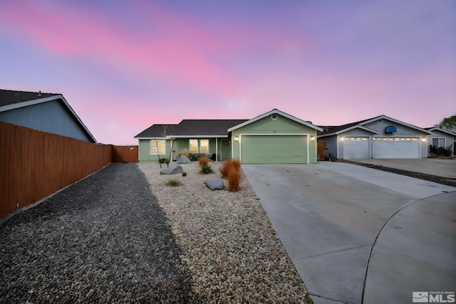 534 Dutch Oven Ct, Fernley, NV 89408 - ranch-style house with driveway, fence, and a garage
