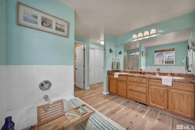 534 Dutch Oven Ct, Fernley, NV 89408 - full bath with wood finished floors, a bath, and double vanity