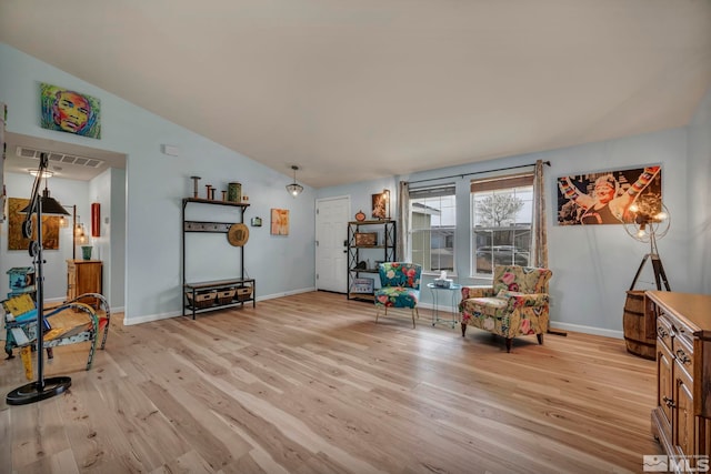 534 Dutch Oven Ct, Fernley, NV 89408 - sitting room featuring light wood-style floors, vaulted ceiling, and baseboards