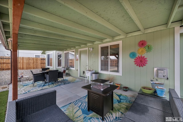 534 Dutch Oven Ct, Fernley, NV 89408 - view of patio featuring fence, outdoor dining space, a fire pit, and heating unit