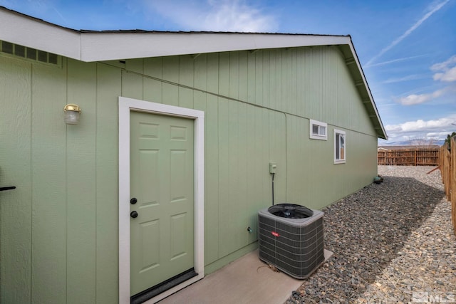 534 Dutch Oven Ct, Fernley, NV 89408 - view of side of home featuring central air condition unit and fence