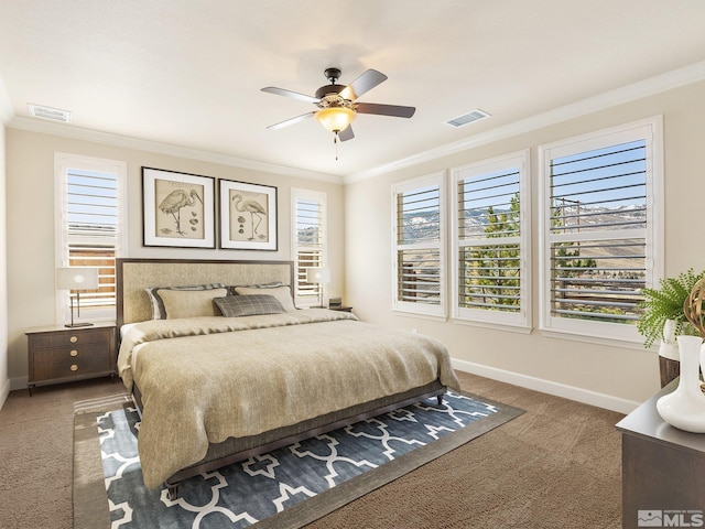bedroom featuring carpet flooring, crown molding, baseboards, and ceiling fan