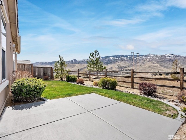 view of yard with a mountain view and a patio area