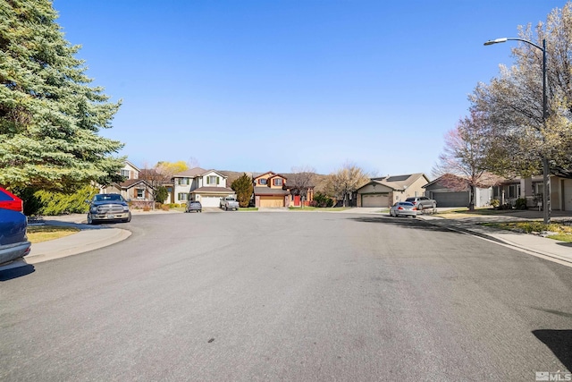 2761 Cheshire, Reno, NV 89523 - view of asphalt road with a residential view, sidewalks, street lighting, and curbs