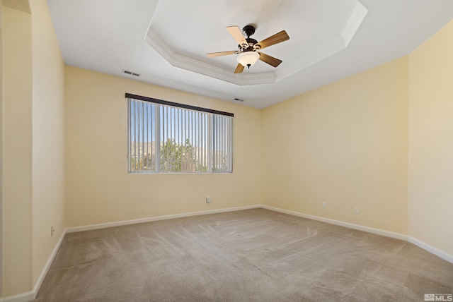 2761 Cheshire, Reno, NV 89523 - spare room featuring a tray ceiling, light carpet, crown molding, a ceiling fan, and baseboards