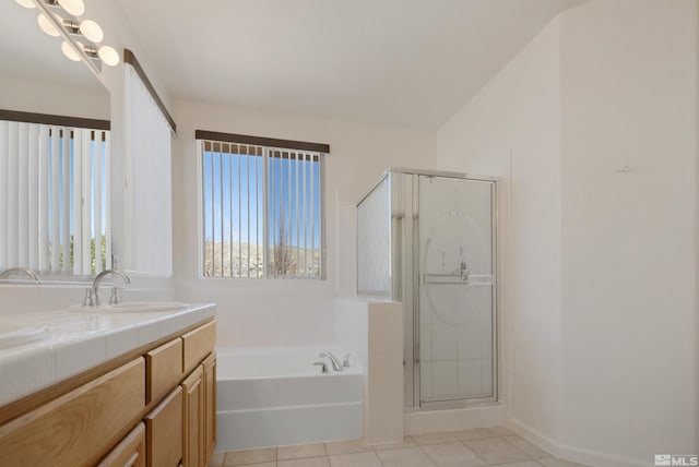 2761 Cheshire, Reno, NV 89523 - bathroom featuring tile patterned flooring, vanity, a stall shower, a bath, and baseboards