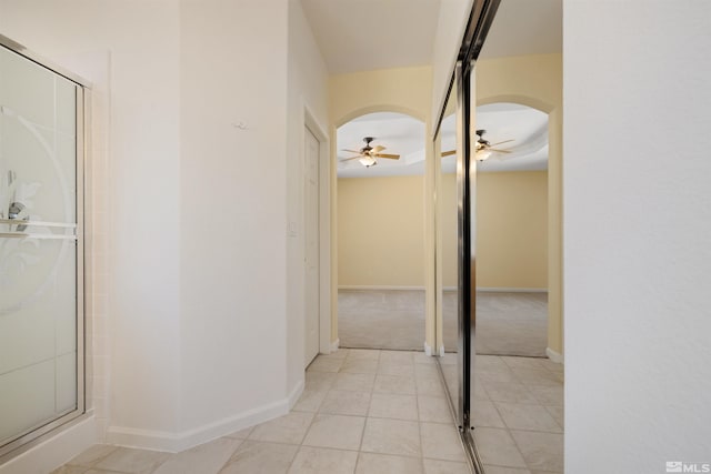2761 Cheshire, Reno, NV 89523 - hallway with arched walkways, light tile patterned flooring, and baseboards