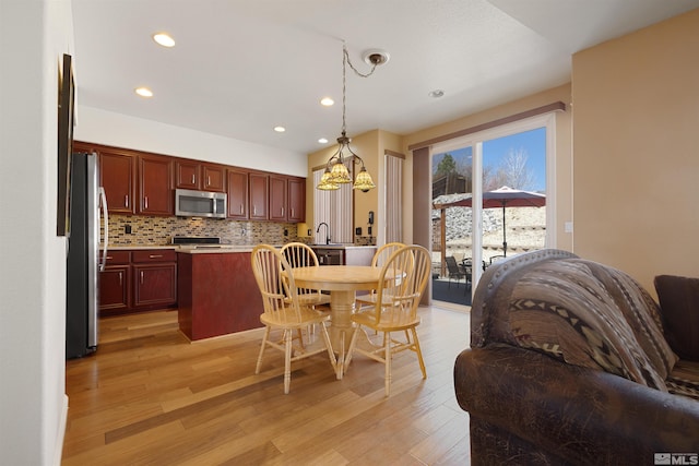 2761 Cheshire, Reno, NV 89523 - dining area featuring light wood-style flooring, recessed lighting, and a chandelier