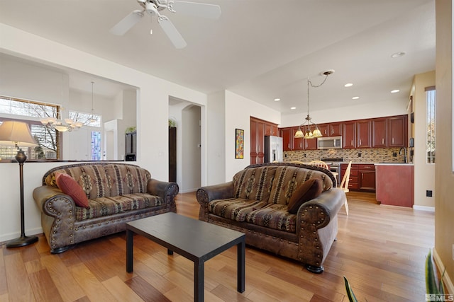 2761 Cheshire, Reno, NV 89523 - living room with a chandelier, healthy amount of natural light, light wood-type flooring, and recessed lighting