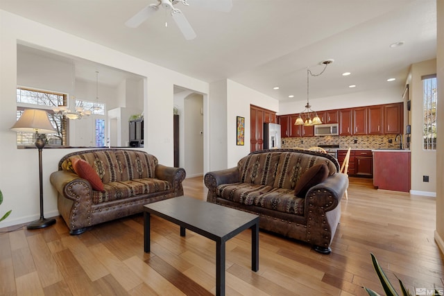 2761 Cheshire, Reno, NV 89523 - living room featuring a chandelier, light wood-type flooring, ceiling fan, recessed lighting, and baseboards