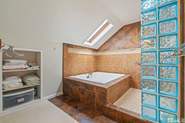 2640 Emily St, Reno, NV 89503 - full bathroom with vaulted ceiling, a skylight, a walk in shower, and a garden tub