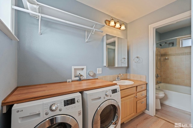 2640 Emily St, Reno, NV 89503 - laundry room with washer and dryer and light wood-type flooring