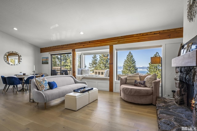 400 Fairview Blvd Unit 8, Incline Village, NV 89451 - living room featuring a stone fireplace, light wood finished floors, healthy amount of natural light, recessed lighting, and vaulted ceiling