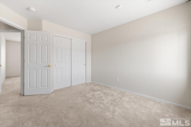 7753 Tulear St, Reno, NV 89506 - unfurnished bedroom featuring carpet floors, baseboards, and a closet